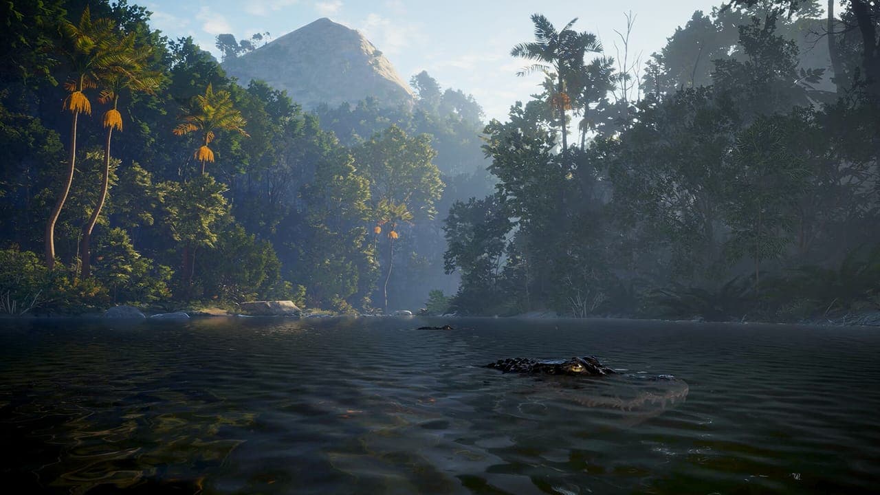 A calm jungle river with palm trees and a forested mountain behind it, a dark shape floating in the water, in theHunter: Call of the Wild