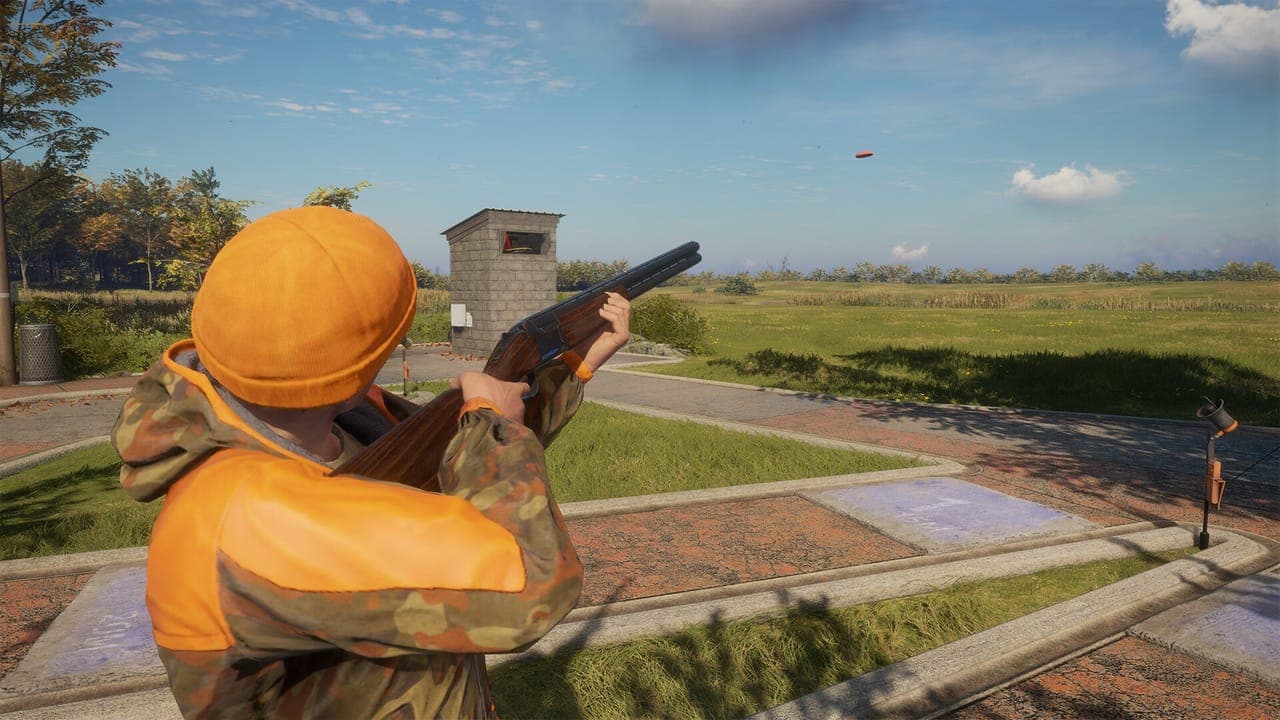 A hunter in an orange cap and camouflage jacket aiming an over-under shotgun at a flying clay target on a paved shooting range, in theHunter: Call of the Wild